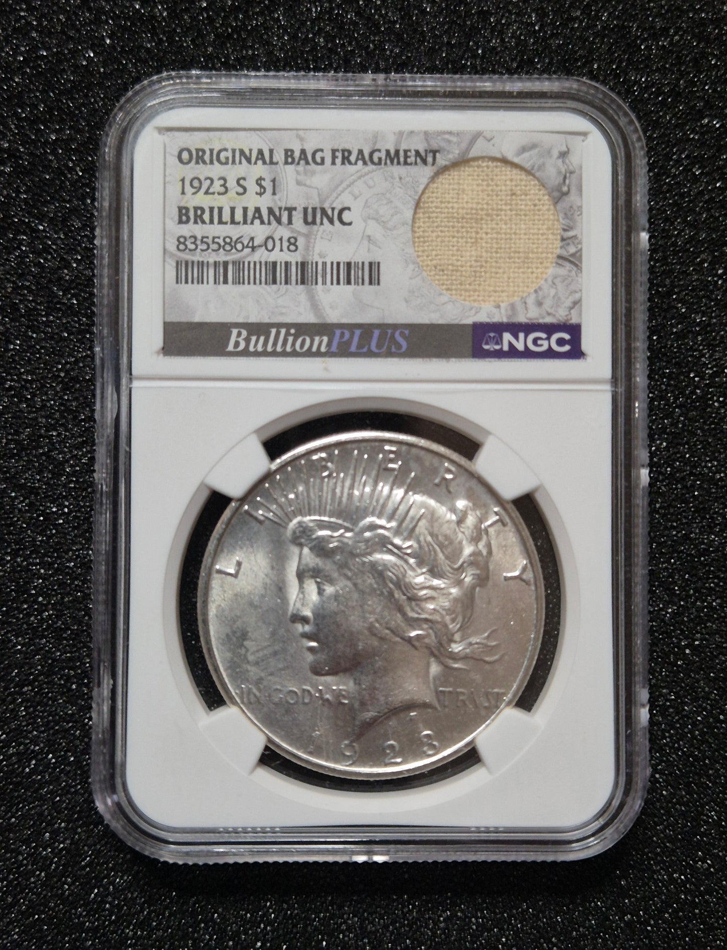 1923 Peace Dollar - Brilliant Uncirculated, with Bag Fragment. Certified by NGC.