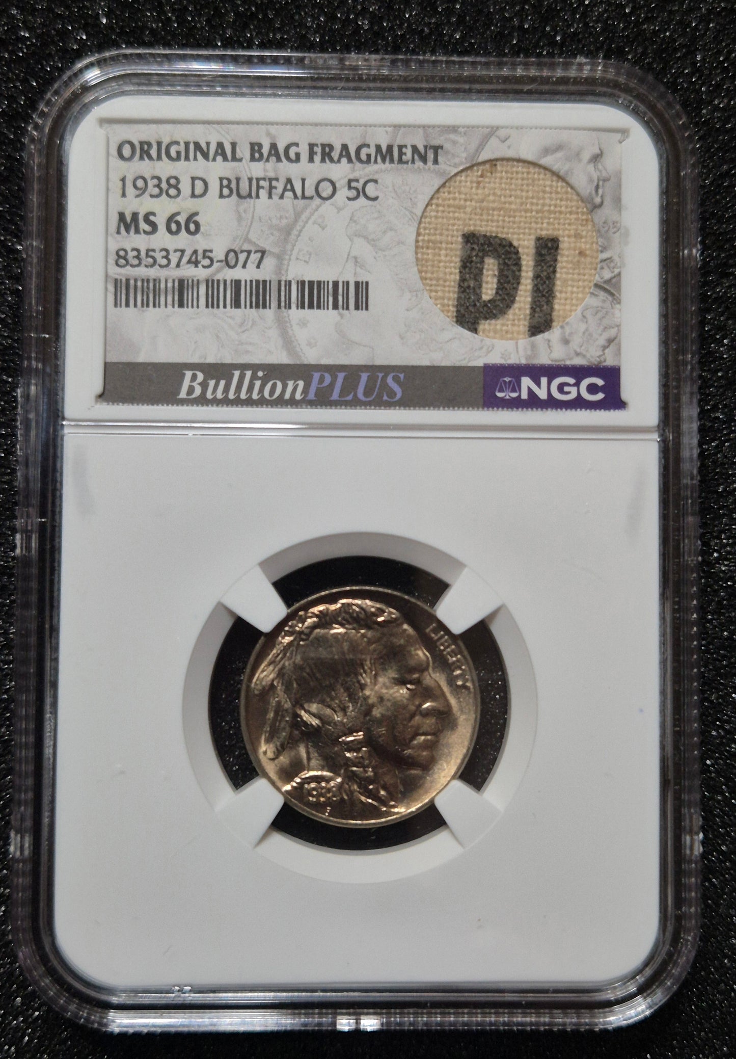 1938-D Buffalo Nickel, MS66 by NGC and presented with a BullionPLUS “Original Bag Fragment” label that includes a small piece of an original U.S. Mint bag.