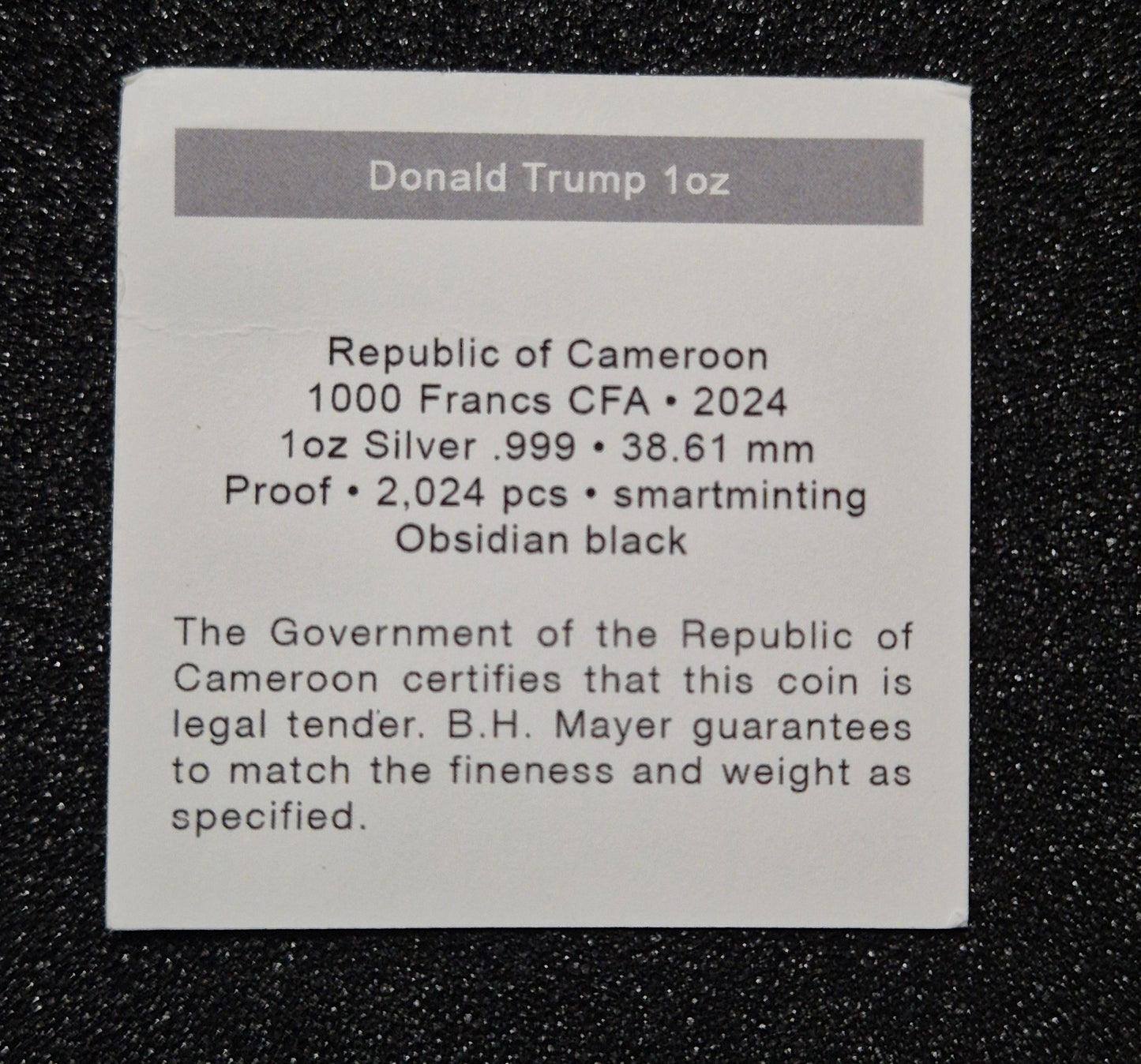 2024 Republic of Cameroon 1,000 Francs CFA silver proof coin titled “Donald Trump – All Together”, struck in high-relief with an obsidian-black finish by B.H. Mayer.